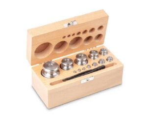 Photo d'un jeu de poids en inox tourné Classe M2 en coffret en bois