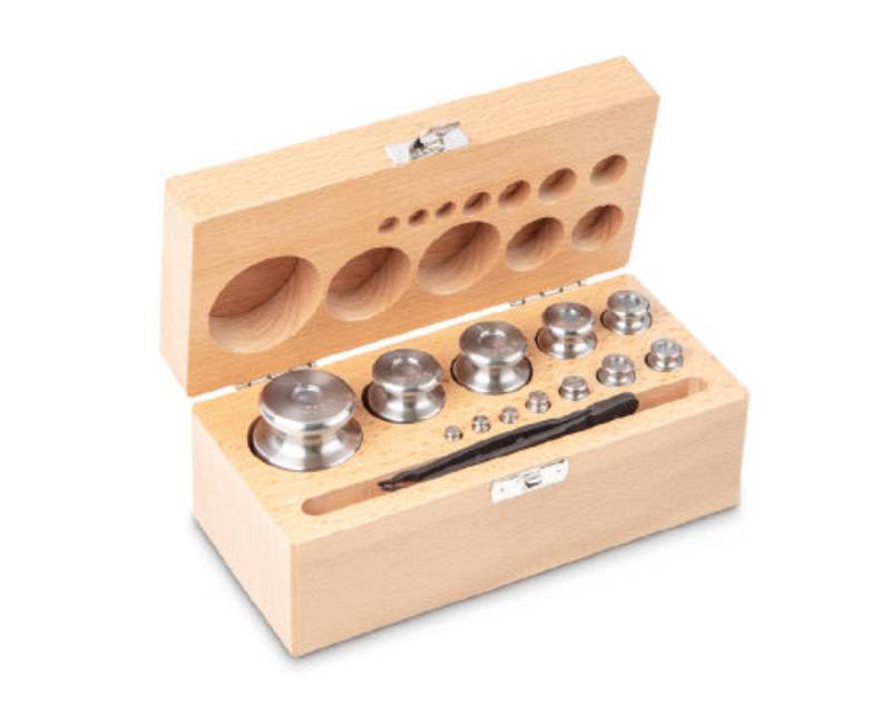 Photo d'un jeu de poids en inox tourné Classe M2 en coffret en bois